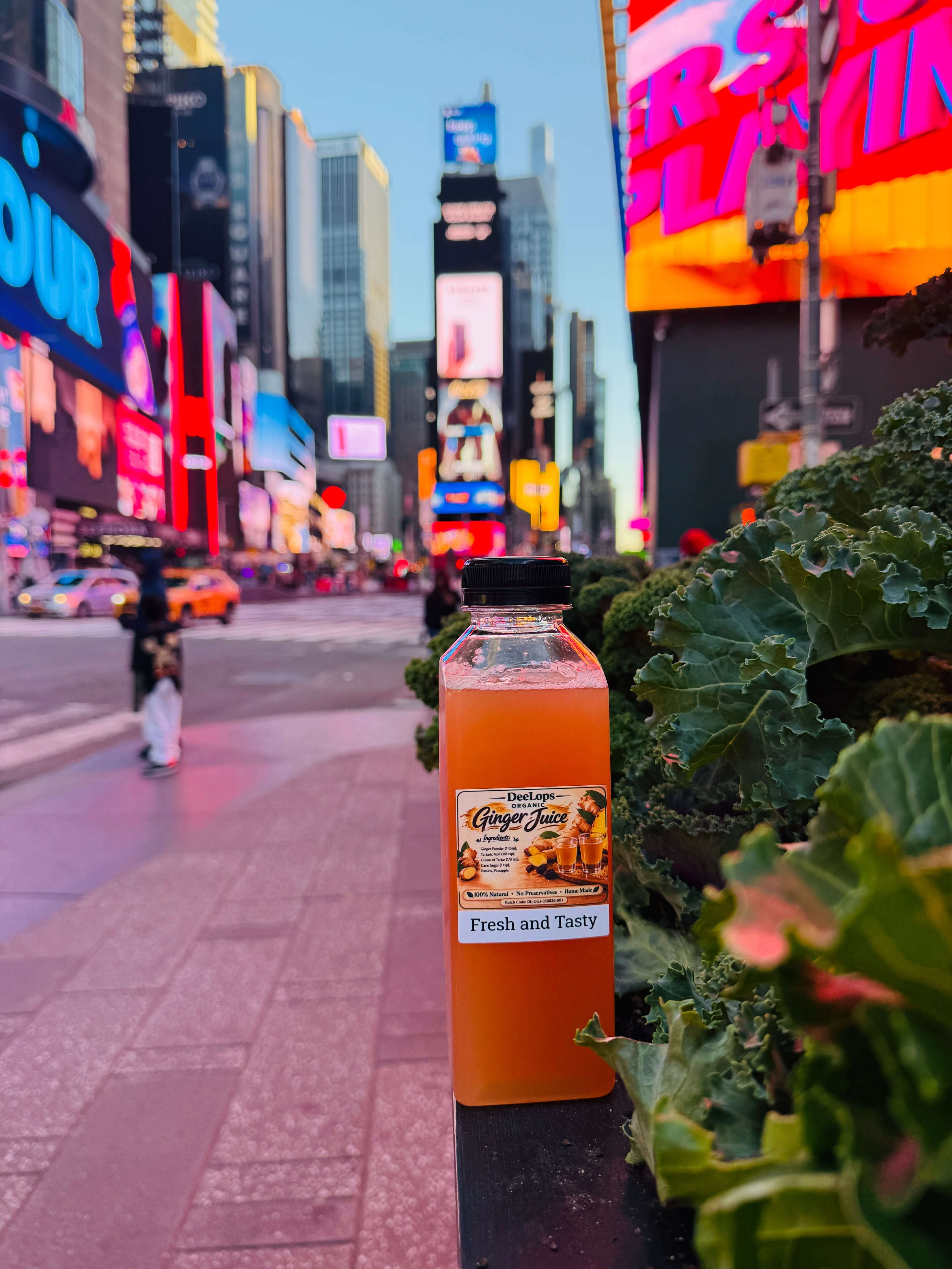 DeeLops Organic Ginger Juice bottle with a city backdrop